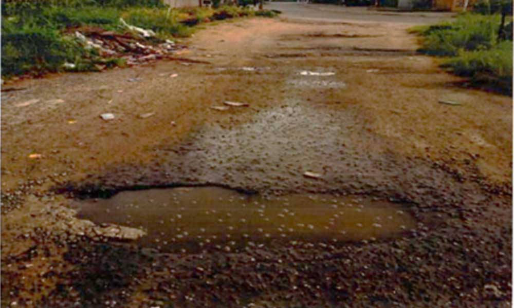 Dilapidated road pavement before rehabilitation at Saro Close